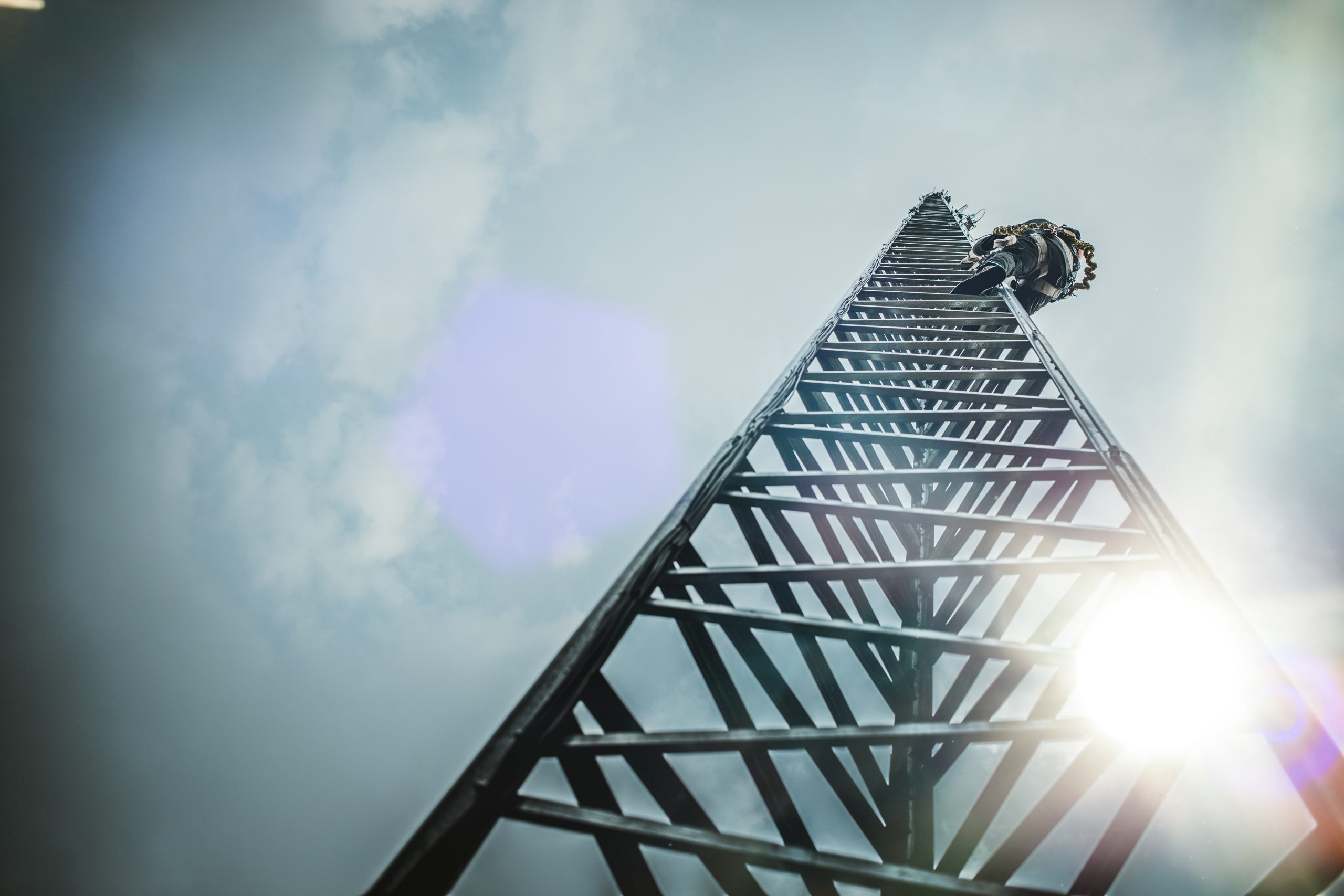 Telecom Worker Climbing Antenna Tower